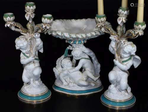 A 19thC Copeland porcelain centrepiece garniture, comprising dish of oval form held by fighting