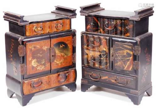 An early 20thC Japanese black lacquer Shodhana type cabinet, set with raised figures, the scroll top