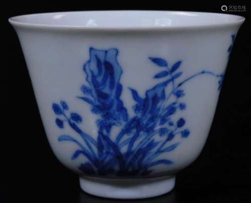 A Chinese porcelain tea bowl, of bell shaped form, profusely decorated with flowers, with seal