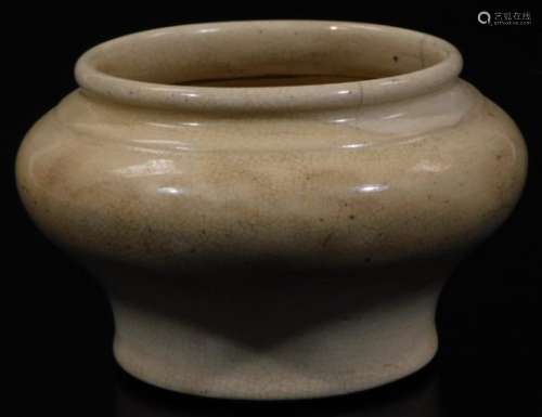 A Ming type pottery bowl, of bellied circular form, on circular foot, cream decorated, unmarked, 8cm