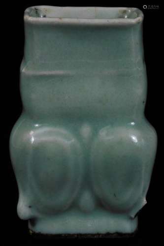 A Chinese Celadon pottery vase, of floral form, on oval foot, labelled beneath Ming Sky Blue Vase,