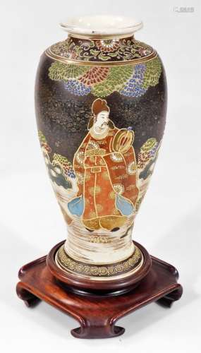 A large Japanese pottery vase, of shouldered tapering circular form, profusely decorated and