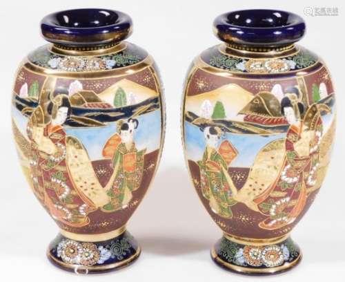A pair of early 20thC Japanese ovoid vases, each decorated with panels of flowering trees, with