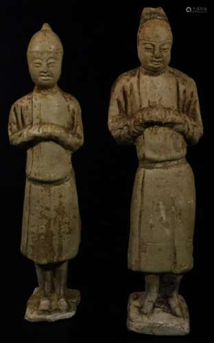 A matched pair of terracotta tomb style figures, of a Chinese lady and gentleman in flowing robes,