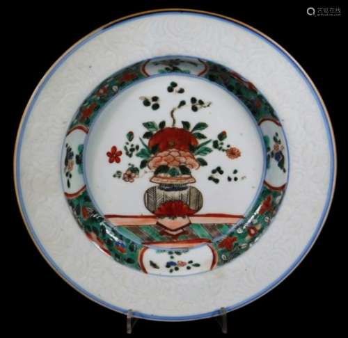 A Chinese famille verte porcelain dish, decorated with centre vase of flowers, with an inner