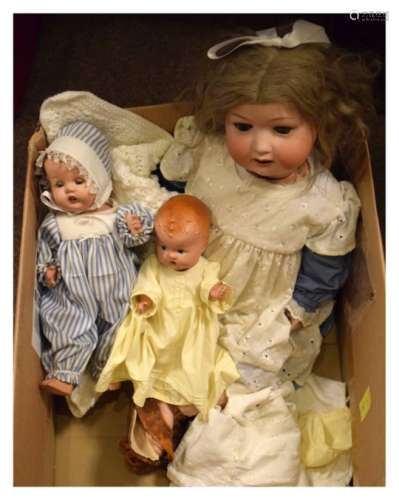 Large early 20th Century bisque head doll, the girl having blond hair with bow, wearing a blue and