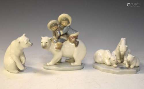 Three Lladro Polar Bear figures comprising 5353 'Eskimo Riders', 1443 'Bearly Love', and a single