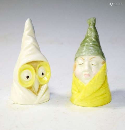 Two Royal Worcester porcelain candle snuffers, Owl and Mr. Caudle (2)