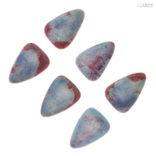 Six Ruskin pottery ceramic mounts, each of rounded triangular form with pink/lilac glaze, 3cm