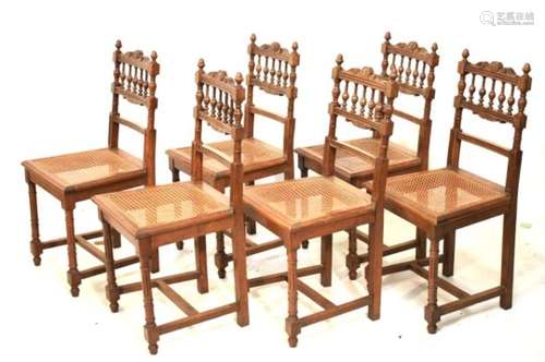 Set of six early 20th Century oak cane seat dining chairs