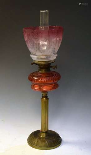 Late 19th/early 20th Century brass oil lamp having cranberry glass reservoir and etched pink glass