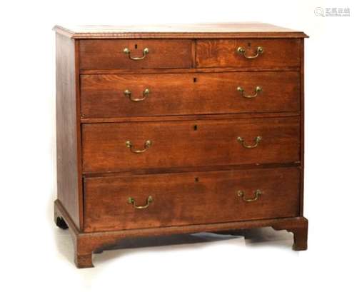 19th Century oak chest of two short over three long drawers, fitted brass swan neck handles, on