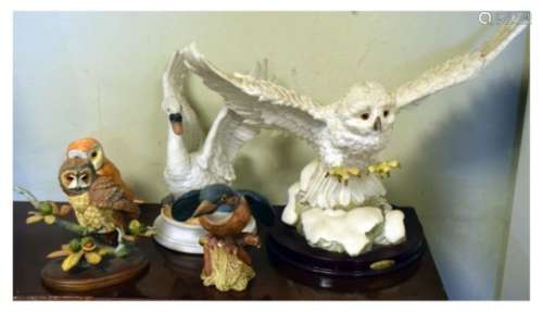 Beswick Barn Owl and Kingfisher, together with a porcelain Swan and two further resin bird