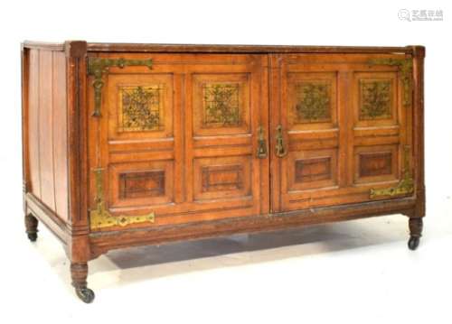 Late Victorian Aesthetic style inlaid oak cabinet of two four-panelled doors with decorated