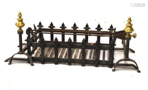 Wrought iron fire grate with pair of brass finialed dogs, and a pair of tongs, the grate measuring