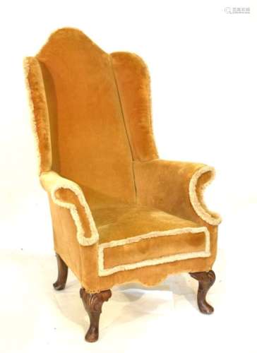 Old reproduction Georgian style wingback armchair having walnut shell carved cabriole supports