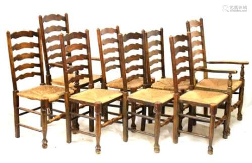 20th Century set of eight oak country ladder back dining chairs having rush seats (2 carvers, 6