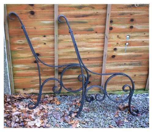 Pair of wrought iron scroll design bench ends