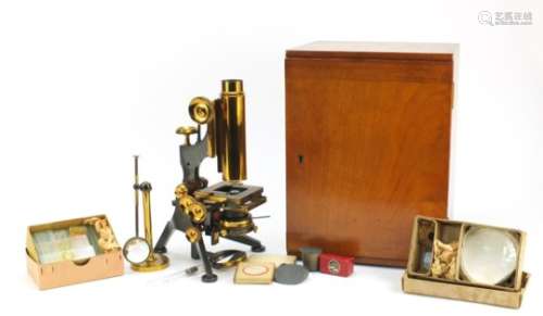 Victorian brass monocular microscope with accessories and case by W Watson and Sons of London,