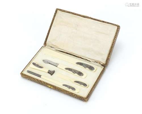 Art Nouveau five piece ivory desk set with applied silvered metal mounts, housed in a fitted case,