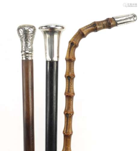 Three silver mounted walking sticks including one with ebony shaft, the largest 93cm in length : For