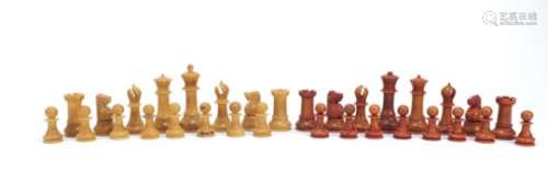 Carved vegetable ivory half stained chess set, the largest piece 9cm high : For Further Condition