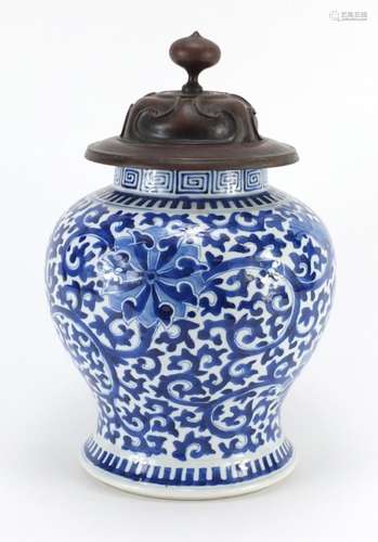 Chinese blue and white porcelain baluster vase, hand painted with flower heads amongst scrolling