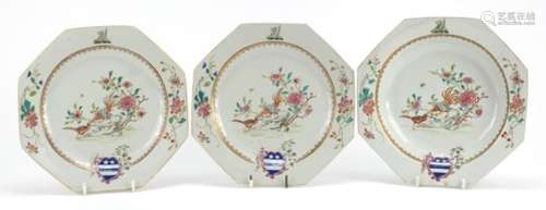 Two Chinese porcelain armorial plates and a soup bowl, each finely hand painted in the famille