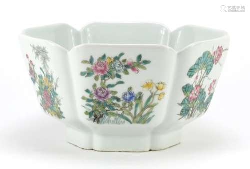 Chinese porcelain bowl hand painted in the famille rose palette with panels of flowers, six figure