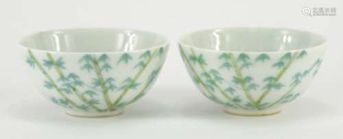 Pair of Chinese porcelain bowls hand painted with bamboo, character marks to the bases, each 9cm