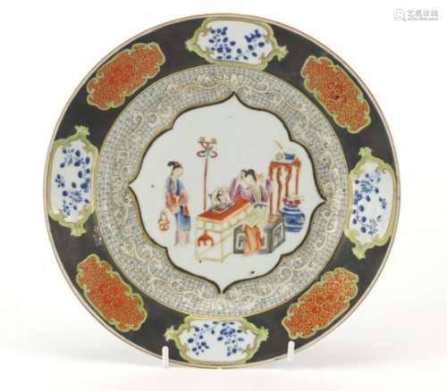 Chinese porcelain plate, finely hand painted in the famille rose palette with two young girls within