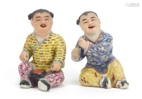 Pair of Chinese hand painted porcelain figures of children, the largest 10cm high : For Further