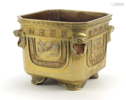 Chinese bronze planter with lion head handles, finely cast panels of animals and calligraphy,