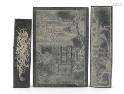 Three Chinese ink stones including one carved with two young girls in a palace, the largest 11.5cm x
