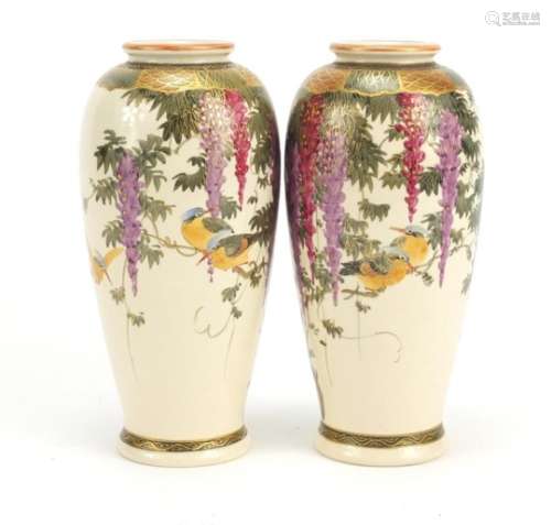 Pair of Japanese Satsuma pottery vases hand painted with birds of paradise amongst wisteria,