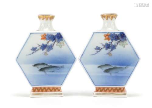 Pair of Japanese Fukagawa porcelain vases with hexagonal bodies hand painted with fish and