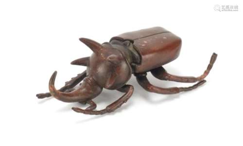 Japanese patinated bronze rhino horn beetle with articulated wings, impressed marks to the