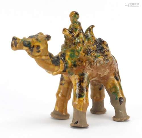 Turkish Kutahya pottery camel having a brown, green and yellow glaze, 20cm high : For Further