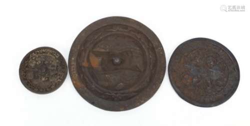 Three Islamic cast iron hand mirrors, the largest 16cm in diameter : For Further Condition Reports