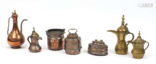 Middle Eastern metalware including coffeepots and containers, the largest 35cm high : For Further