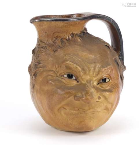 Large Martin Brothers stoneware double face jug, incised R W Martin Bros London Southall 23.5.1910