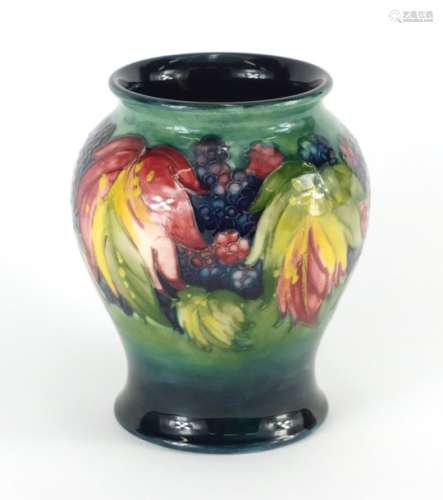 William Moorcroft pottery baluster vase, hand painted in the leaf and blackberry pattern, painted