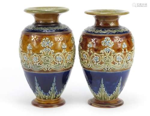Pair of Doulton Lambeth stoneware vases, hand painted and decorated in low relief with stylised