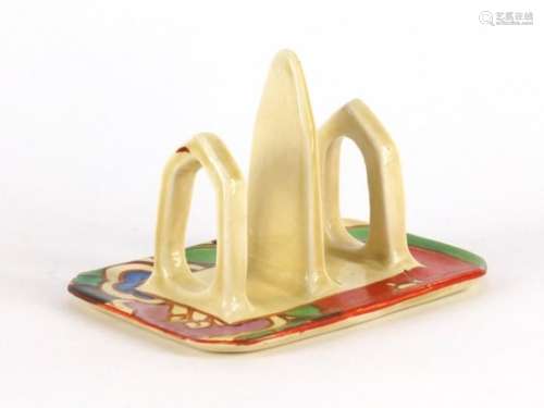 Clarice Cliff Fantasque toast rack, hand painted in the Gardinia pattern, factory marks to the base,