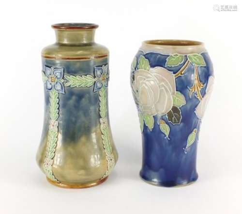 Two Doulton Lambeth vases, impressed factory marks and numbers to the bases, the largest 25cm high :