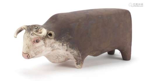 Stylised pottery model of a bull, incised initials and dated '12 to the base, 39cm in length : For