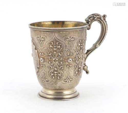 Victorian silver tankard by George Fisher, embossed with floral motifs and gilt interior, London