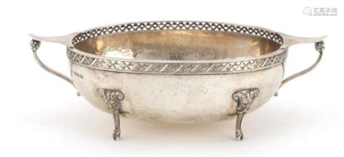 Arts & Crafts silver twin handled bowl by Albert Edward Jones, with pierced rim, planished body