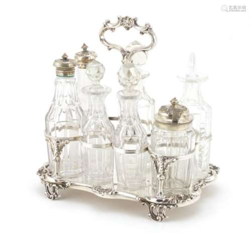 Georgian silver seven bottle cruet stand by James Dixon & Sons, with seven glass bottles, some