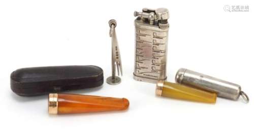 Smoking objects comprising two amber coloured cheroots with 9ct gold mounts, silver cheroot case,
